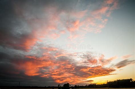 Sunset With Beautiful Cloudy Sky And Treeline Stock Photo Image Of