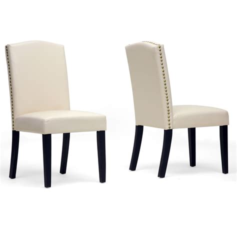 Soft and sleek leather or linen has an irresistible air of elegance. White Upholstered Dining Chair Displaying Infinite ...