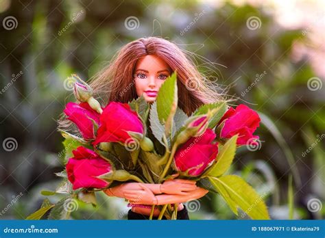 Brunette Barbie Doll With Big Bouquet Of Red Roses Outdoors Editorial Photo Image Of Flower