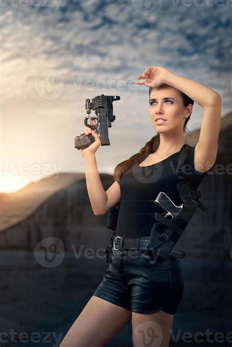 Powerful Woman Holding Gun Action Movie Style 712703 Stock Photo At