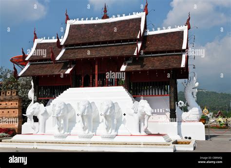 Thai Buddhist Temple Style Building With White Elephant Statues By Entrance Of Royal Flora