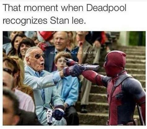 an older man in a suit and sunglasses is pointing at the deadpool on his arm