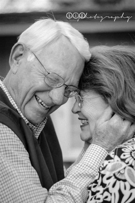 An Older Man And Woman Embracing Each Other In Black And White Photo With Text Overlay