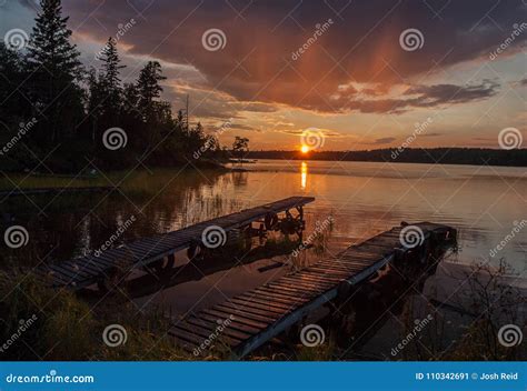 Two Docks In Sunset Over Lake Stock Image Image Of Canadian Docks