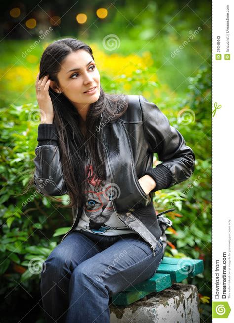Portrait Of A Beautiful Woman With Long Hair And Leather Jacket Stock
