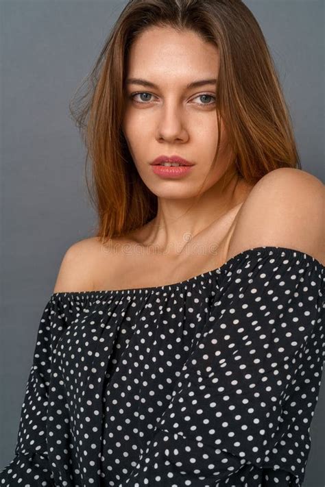Young Woman Casual Studio Isolated On Gray Looking Camera Sensual Stock