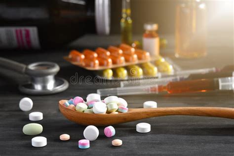 Assorted Pharmaceutical Medicine Pills Tablets And Capsules In Wooden