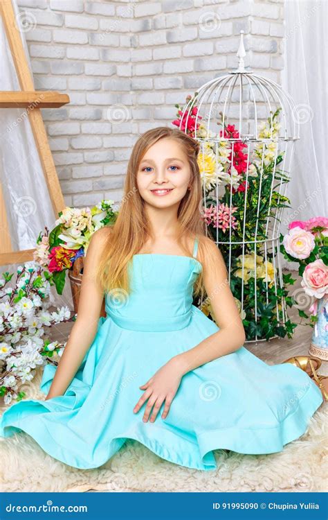 Beautiful Little Girl With Perfect Makeup And Hair Dress Stock Photo