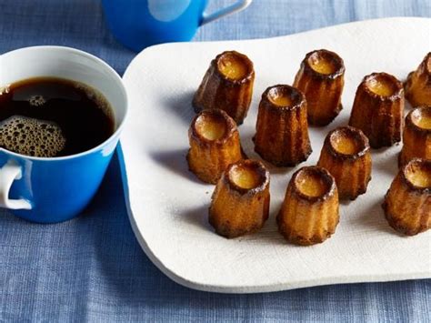 ) is a small french pastry flavored with rum and vanilla with a soft and tender custard center and a dark, thick caramelized crust. Canneles | Recipe | Christmas food desserts, Sweet ...