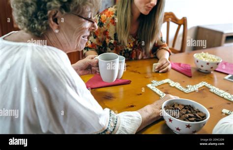 Senior Mother And Daughter Playing Domino Stock Photo Alamy
