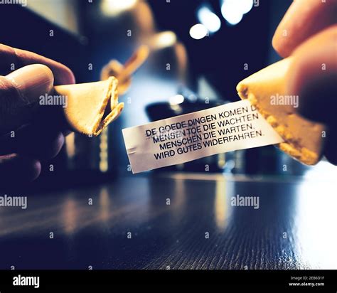 Opening A Fortune Cookie Stock Photo Alamy