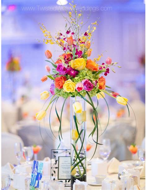 bright colored unique centerpiece this was done by my florist and ours will be very similar