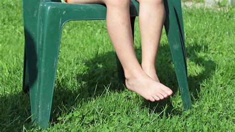 Barefooted Children Legs On Green Grass When Playing With Ball Stock