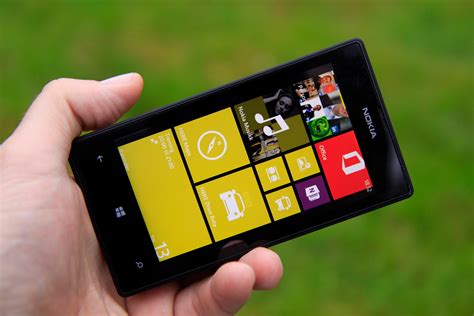 Black Nokia Lumia 520 In Hand Wallpapers And Images Wallpapers