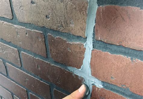 Dampen the sponge and squeeze off excess water. How to Paint a Faux Brick Wall | Gray House Studio