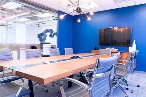 Cool Office Conference Room With Bright Blue Walls A Live Edge Wood