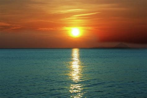 Sunset Over Ocean Photograph By Mothaibaphoto Prints Pixels
