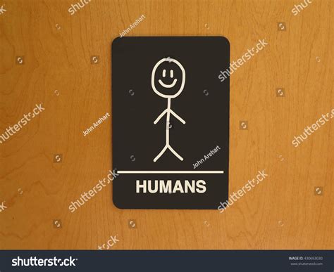 Gender Neutral Restroom Sign With Stick Figure Drawing That Says