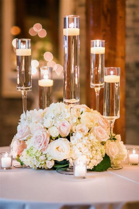 Low Lush Centerpiece Using Ivory And Blush Roses With Hydrangea And Spray Roses Flower