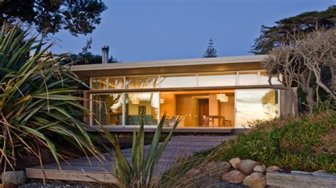 Large overhanging roofs are blind and give plenty of shade on the deck. Modern Beach House Design Contemporary Beach House Plans ...