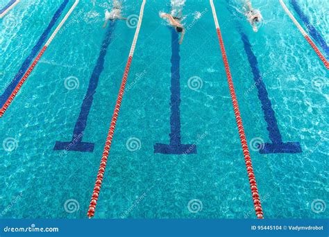 Three Male Swimmers Racing Against Each Other Stock Photo Image Of
