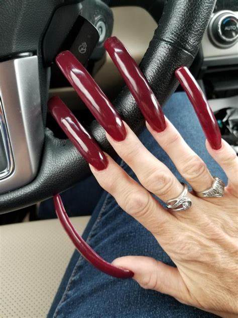 gen in red long red nails curved nails really long nails