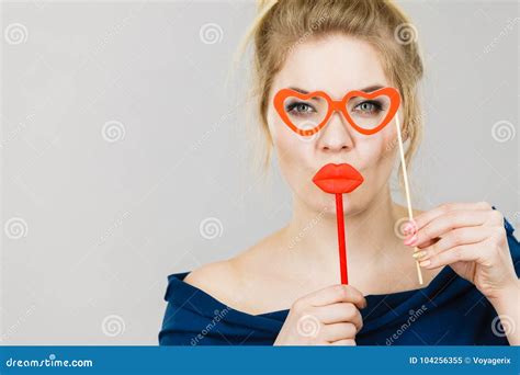 woman holds carnival accessories on stick stock image image of blonde kiss 104256355