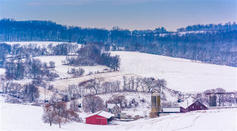 View Of Snow Covered Farm Fields And Rolling Hills In Rural York Stock