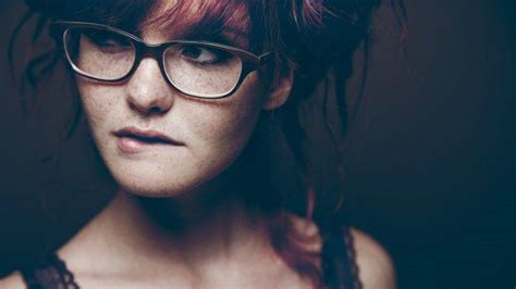 women glasses freckles biting lip redhead looking away women with glasses