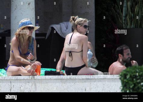 EXCLUSIVE Kate Hudson Relaxes Poolside In A Blue Bikini With Her Brother Oliver Hudson And His