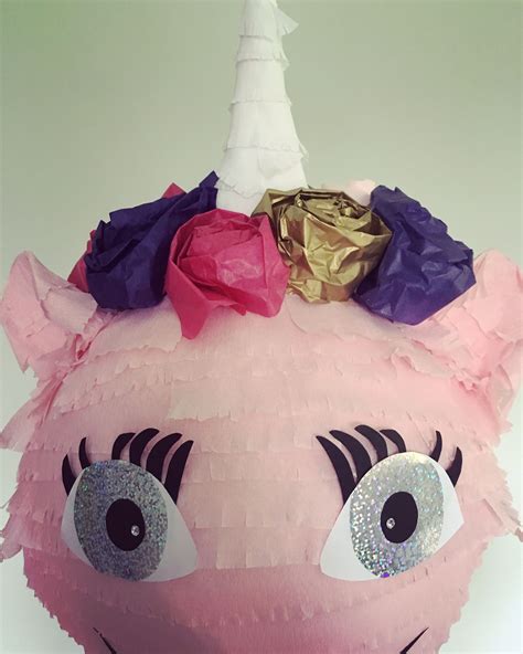 Very cute unicorn Pinata with a twinkle in its eye from www