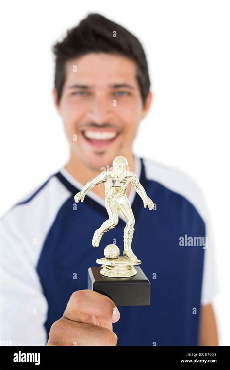Football Player Holding Winners Trophy Stock Photo Alamy