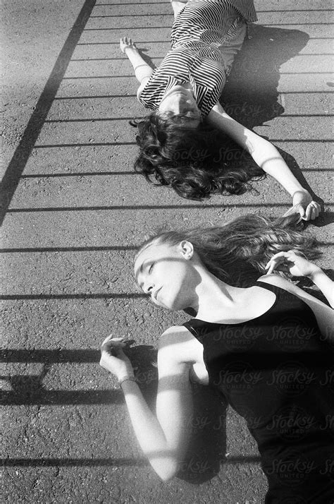 Beautiful Young Women Lying On The Ground By Stocksy Contributor Anna Malgina Stocksy