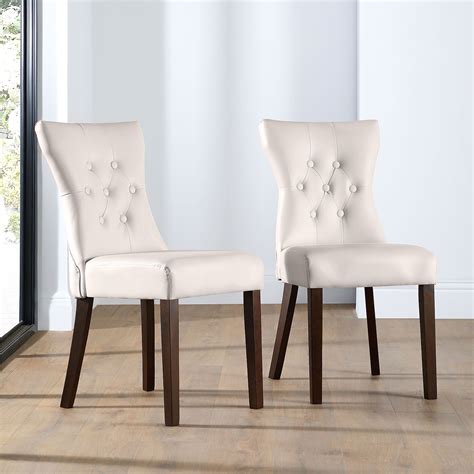 The minimalist aesthetic of the karna dining chair suits decorating tastes both transitional and contemporary. Bewley Ivory Leather Button Back Dining Chair Dark Leg ...