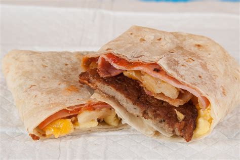 Two scrambled eggs with spicy chorizo, hash browns, melted cheese, jalapenos, sauteed onions, and bell peppers wrapped up in a flour tortilla. Scrambled Eggs and Breakfast Burrito Recipes