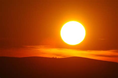 A Big Sun Setting Photograph By Jeff Swan