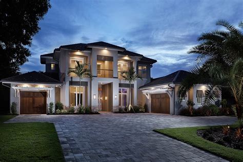 South Florida Design Front Elevation At Dusk Of A 2 Story Coastal