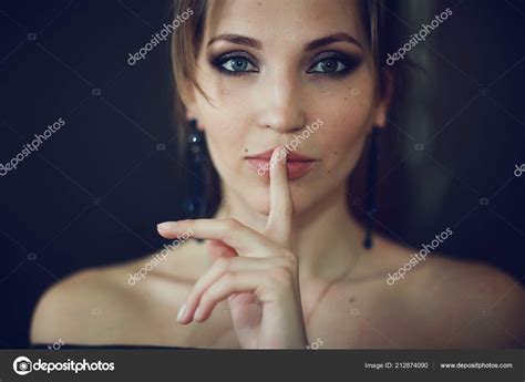 Girl Holding Finger On Mouth — Stock Photo © Xload 212874090