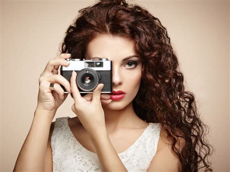 portrait of beautiful woman with the camera girl photographer by oleg gekman photo 128150389