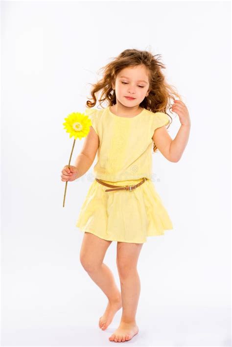 Playful Little Girl In Yellow Dress Stock Photo Image Of Beauty