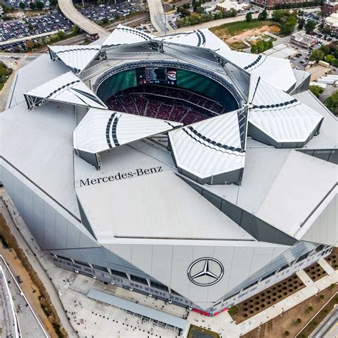 Giant Triangular Panels Overlap To Surround This American Football
