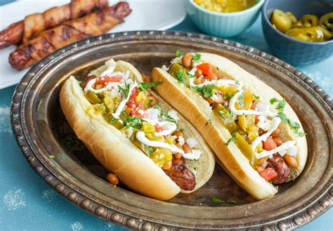 I am in severe need of hot dogs #and chili #and beans #and cheese #maybe some fritos #summer food #i need it. Sonoran Hot Dogs Recipe - Bacon Wrapped with Beans ~ Macheesmo