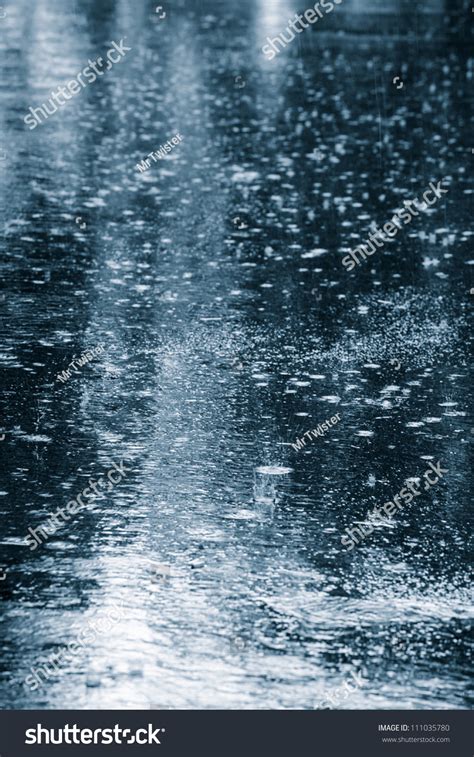 Rain Drops Rippling Puddle Stock Photo 111035780 Shutterstock