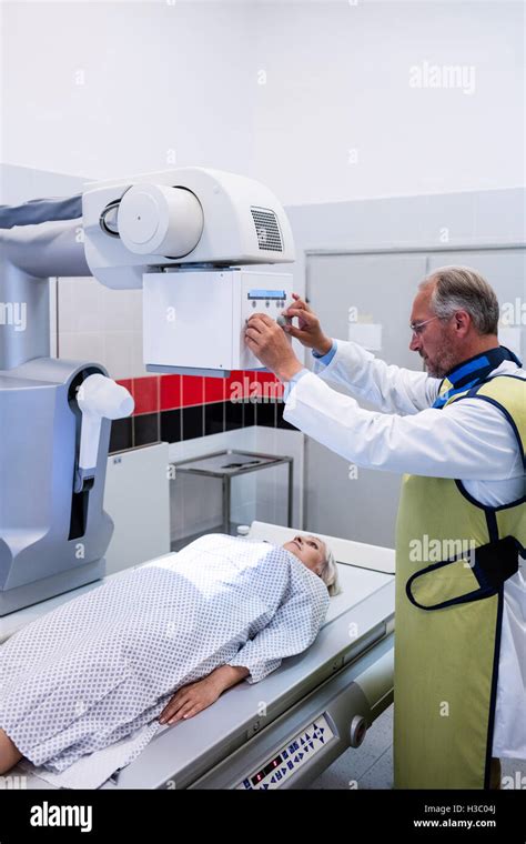 Doctor Using X Ray Machine To Examine Patient Stock Photo Alamy