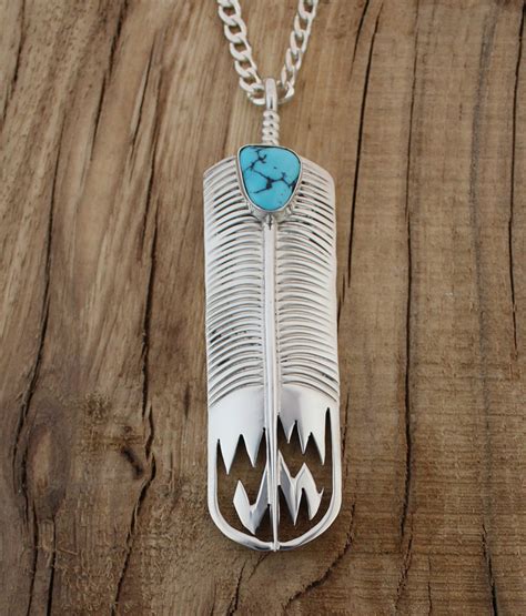 Sterling Silver Feather Pendant With Turquoise Stone