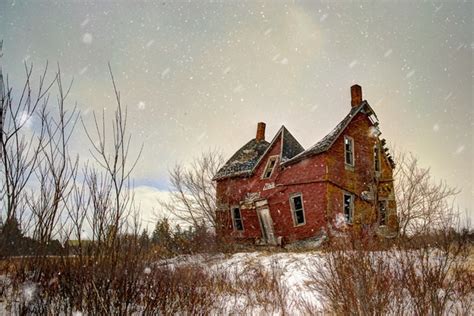 Rural Decay Of A Century Farmhouse In A Winter Snow Storm