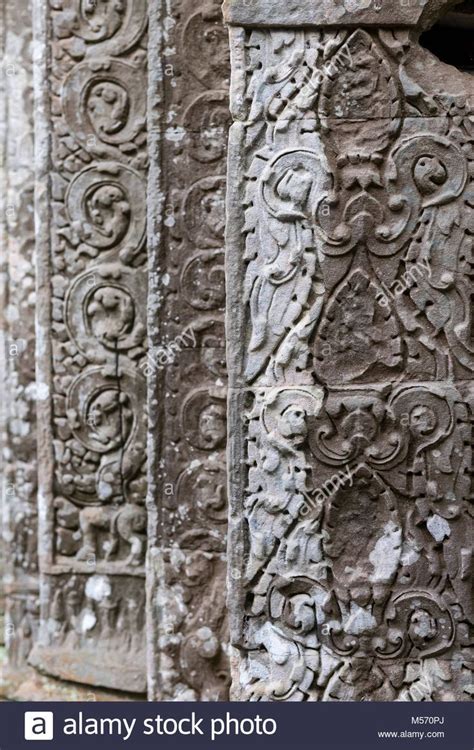 Bas Reliefs On Walls Of Ta Prohm Jungle Temple In Angkor Cambodia