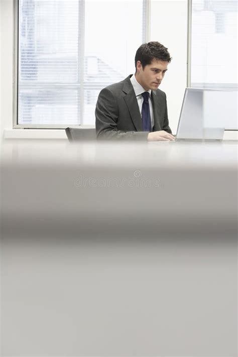 Businessman Using Laptop At Office Desk Stock Image Image Of Serious