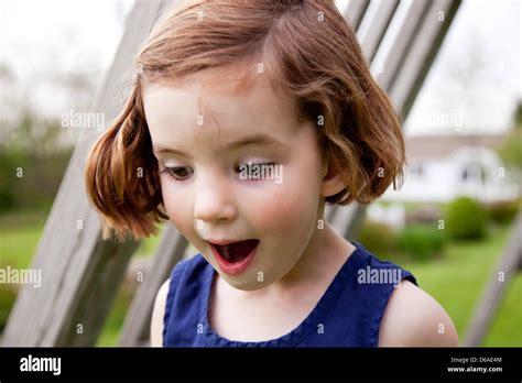 Surprised Girl Looking Down Stock Photo Alamy