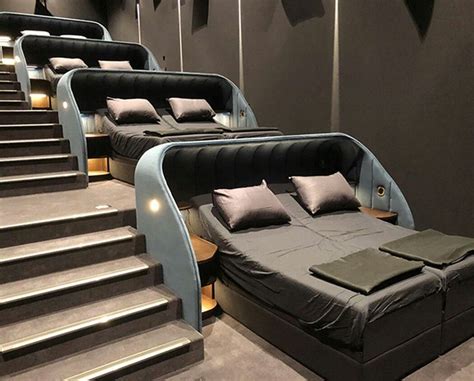 A Movie Theater With Double Beds For Lying Down And Watching Your